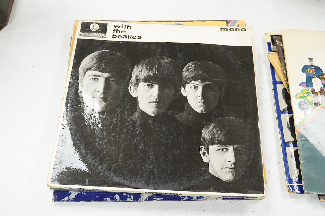 Eleven LP record albums including nine The Beatles and related albums; Beatles For Sale, Hey Jude, Yellow Submarine, All Things Must Pass, etc., together with the Rolling Stones; Their Satanic Majesties Request, and Pink